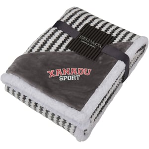 folded gray and white sherpa blanket 