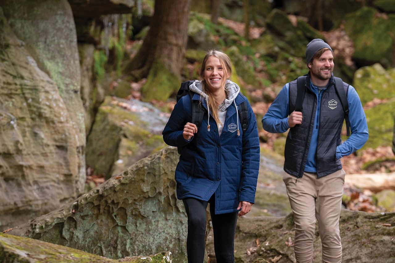 Two hikers in high-quality branded clothing 